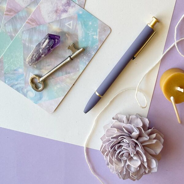 Flat lay with journal and pen — solar return personal new year reflection practice